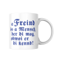 Preview: Weiße Keramiktasse mit bayerischem Spruch „A Freind is a Mensch, der di mog“ – Vorderansicht